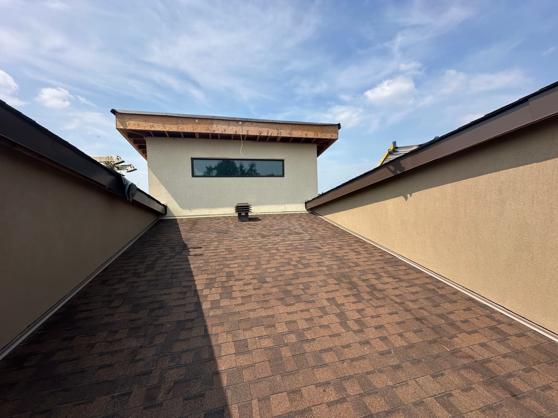 Roof valley where two stuccoed elevations meet