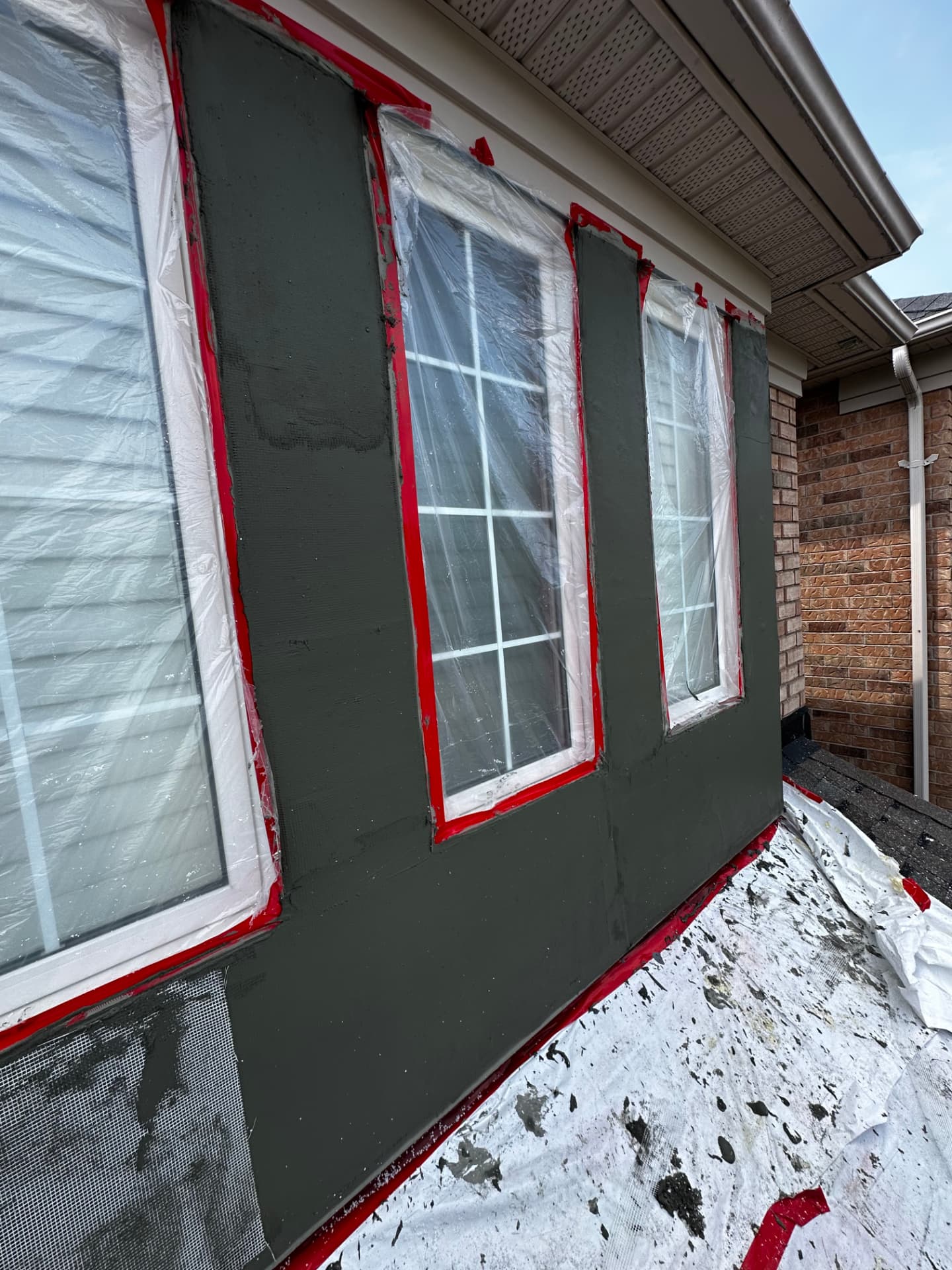 Base coat on with windows masked and red tape lines